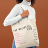 tote-bag-mockup-of-a-woman-with-curly-hair-against-a-plain-backdrop-28869